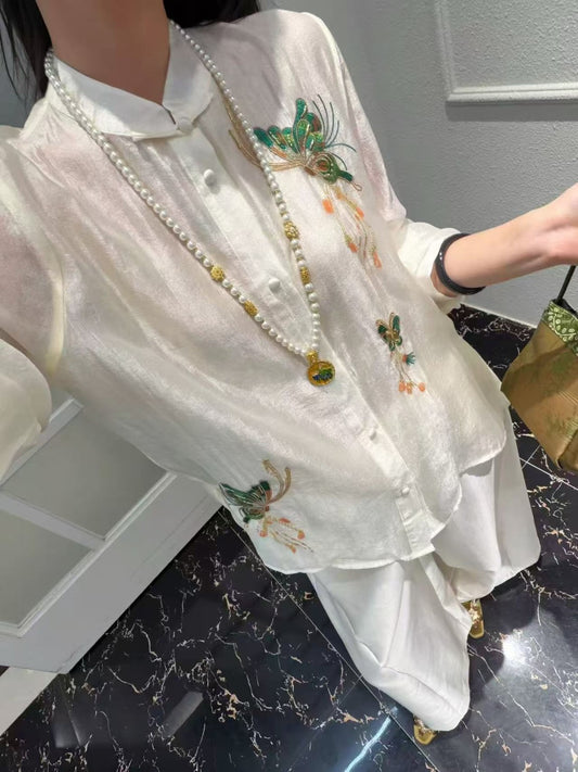 Model wearing the ivory butterfly beaded blouse
