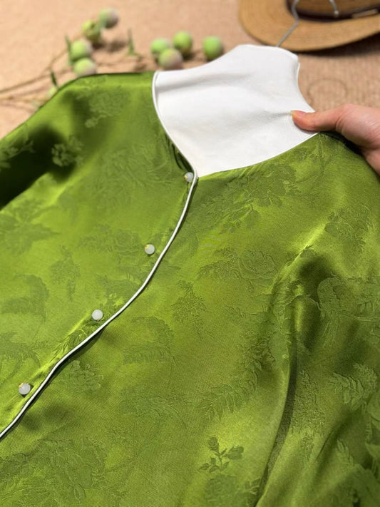 Jade green jacquard with ivory collar and contrast piping detail
