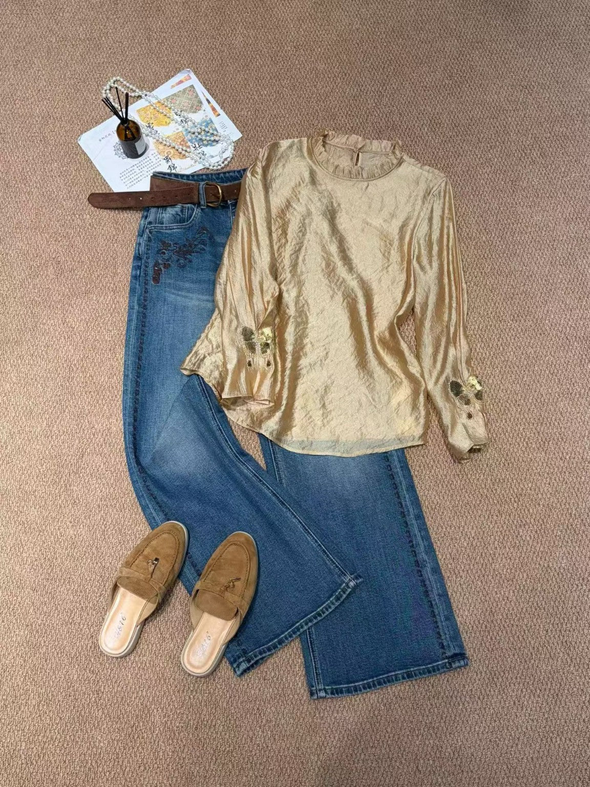 Brown butterfly beaded blouse styled with jeans