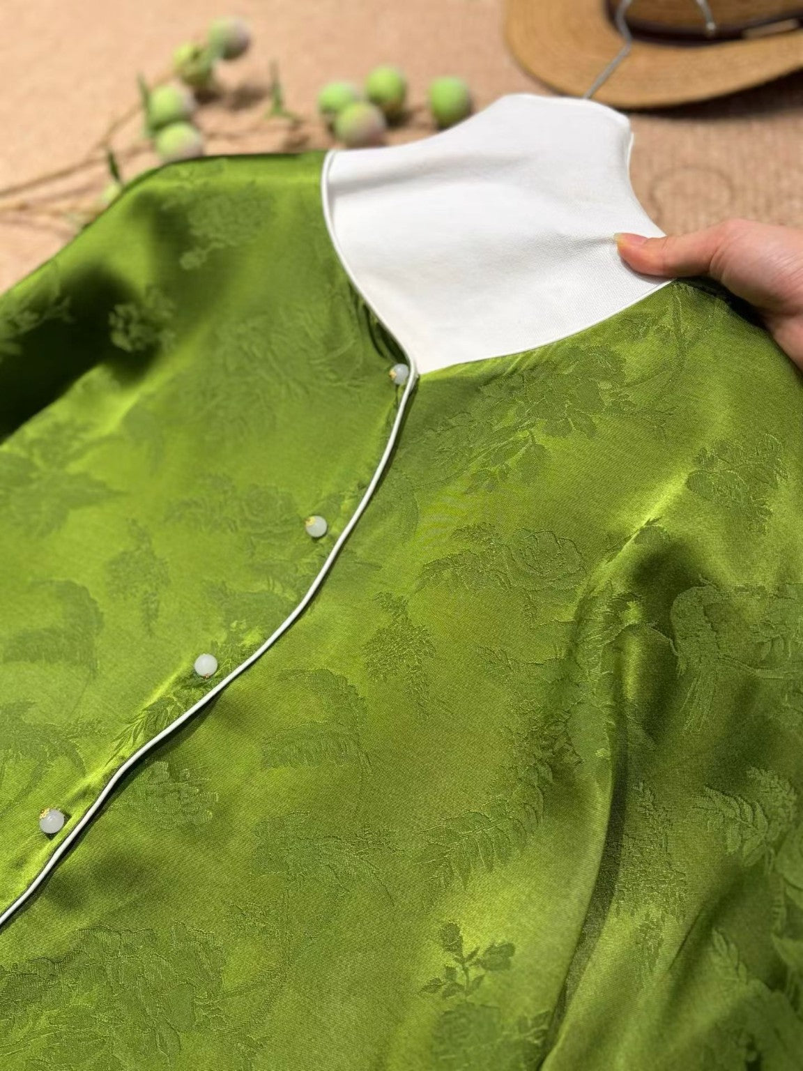 Jade green jacquard with ivory collar and contrast piping detail
