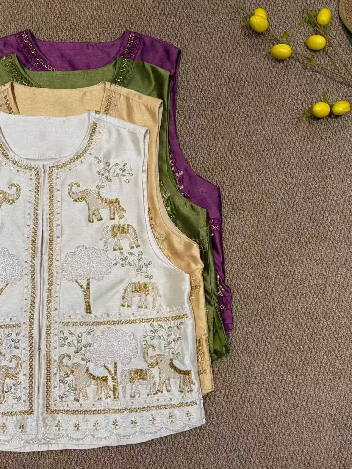 Four vest colourways: purple, green, champagne and ivory