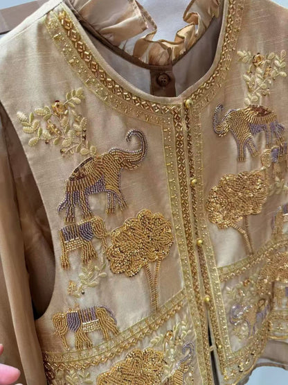 Detailed embroidery and beadwork on the vest