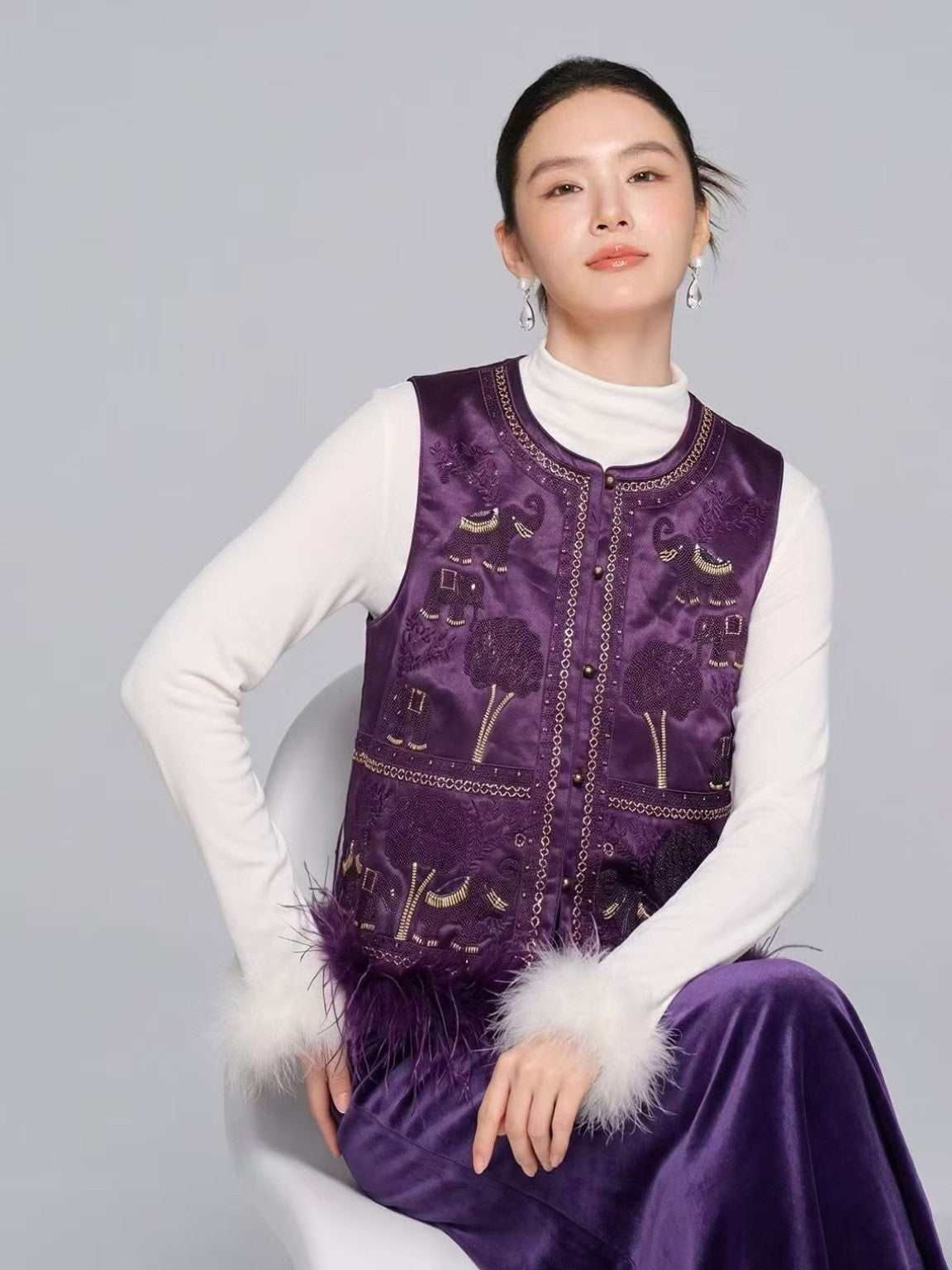 Purple embroidered elephant motif vest, model view